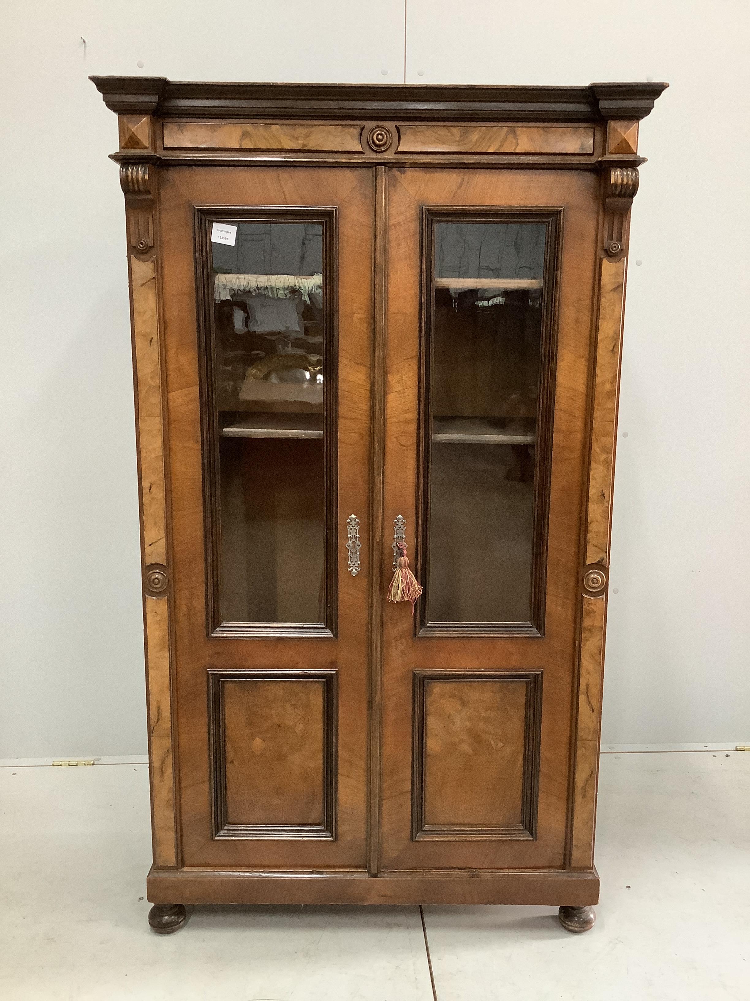 A 19th century French glazed walnut bookcase, width 92cm, depth 42cm, height 156cm